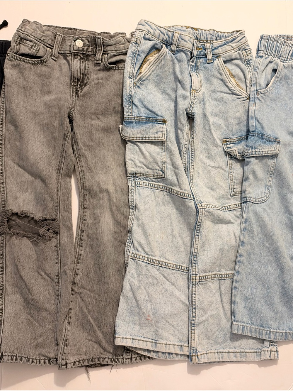 3 pairs of jeans and 1 pair of sweatpants for girls, size 7.